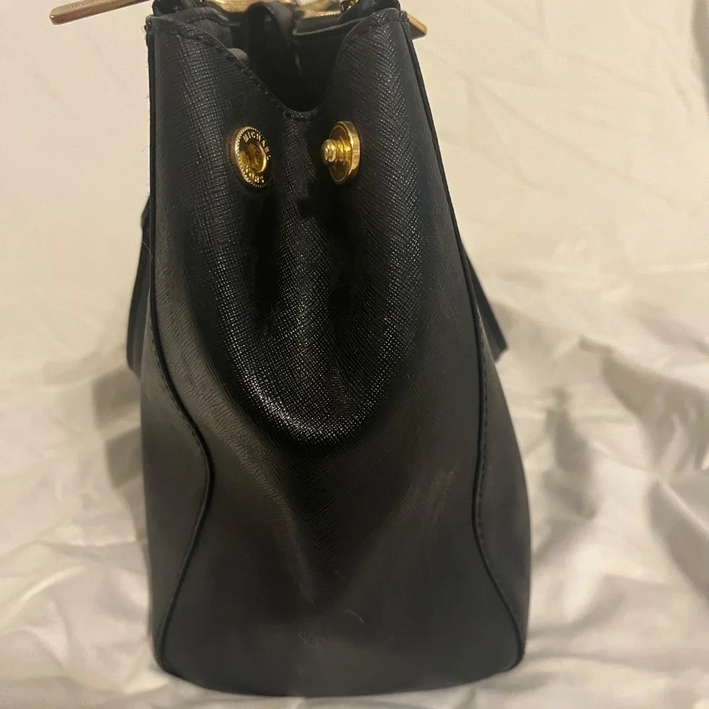 Michael Kors Medium Black Leather Bag. Barely used. Wear on shoulder / handles.